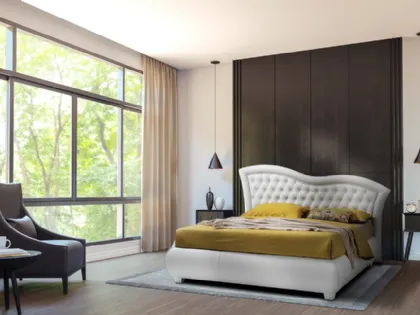 Letto con giroletto bombato e testiera lavorazione capitonnè con cornice ondulata Vivaldi di Artigianaletti